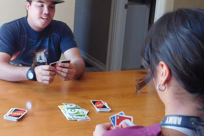 Patient and staff member playing UNO